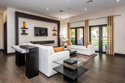 a living room with a white couch and a table