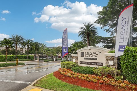 A sign for Legacy at Lake Vista is in front of a building.