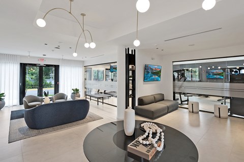 a living room with couches and chairs and a table