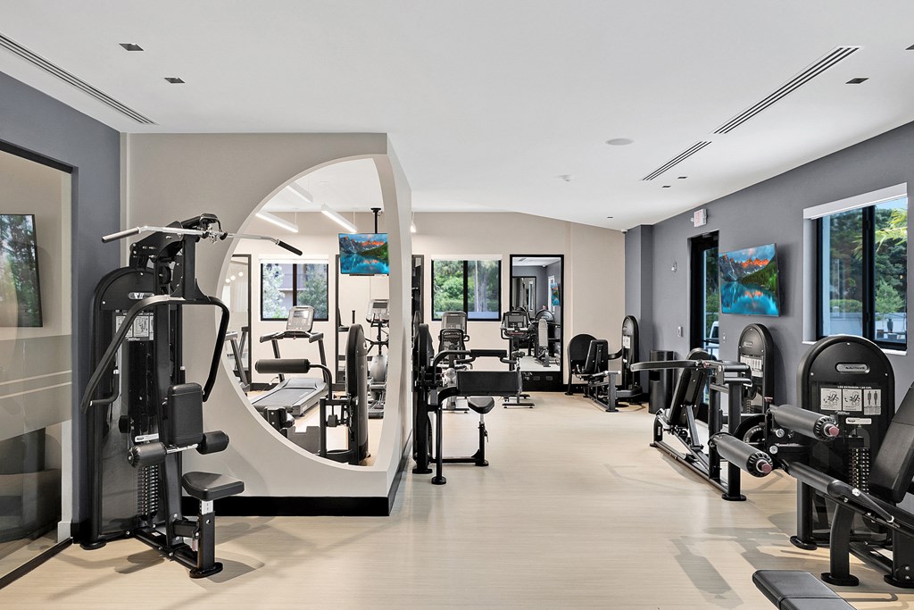a room filled with lots of different types of exercise equipment