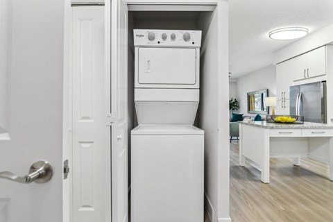 A white oven and dishwasher are built into a kitchen island.