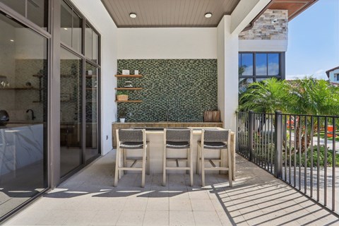 A patio with a table and chairs is shown.