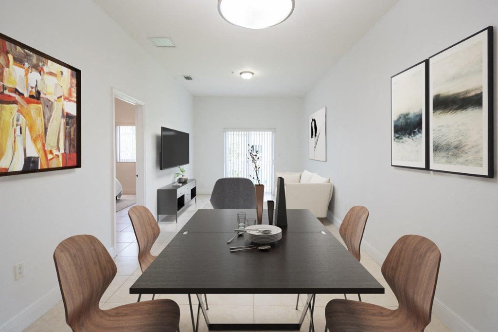 a dining room with a table and chairs