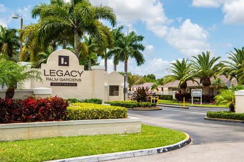 the legacy at palm gardens entrance to the leasing office with palm trees