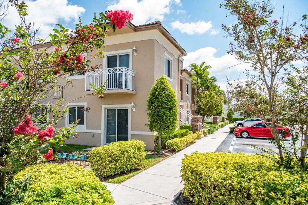 a building with a red car parked in front of it