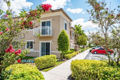 a building with a red car parked in front of it