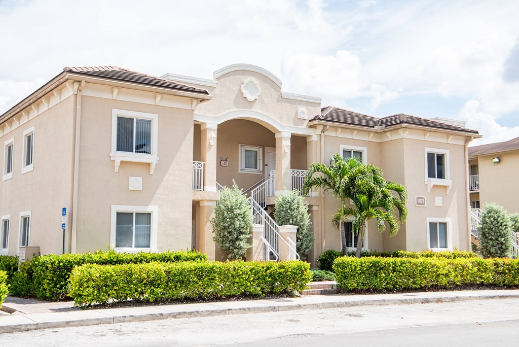 a building with a palm tree in front of it