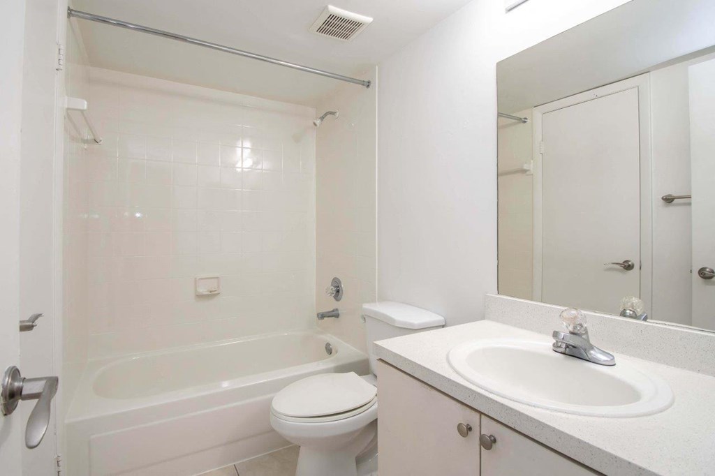 a bathroom with a sink toilet and a shower