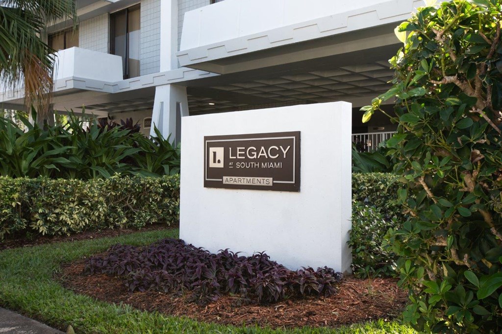 a sign in front of a building