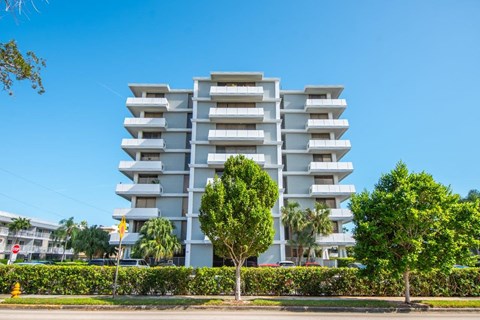 a view of an apartment building from the street