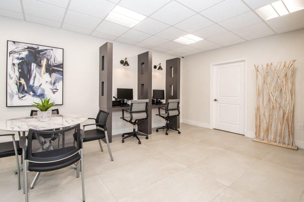 a conference room with a table and chairs