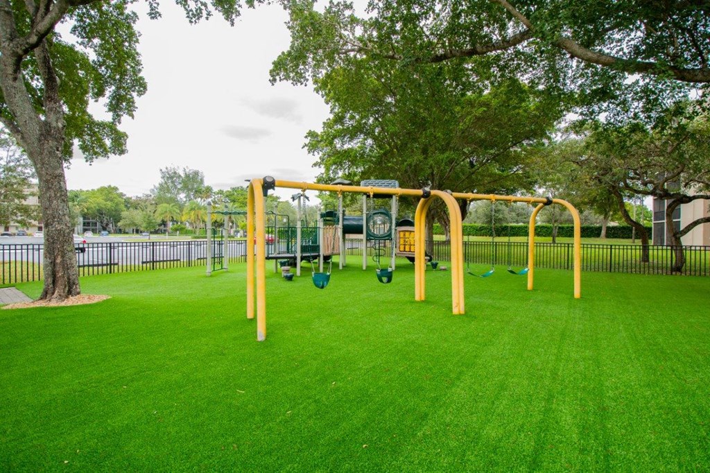 a playground in a park near a body of water