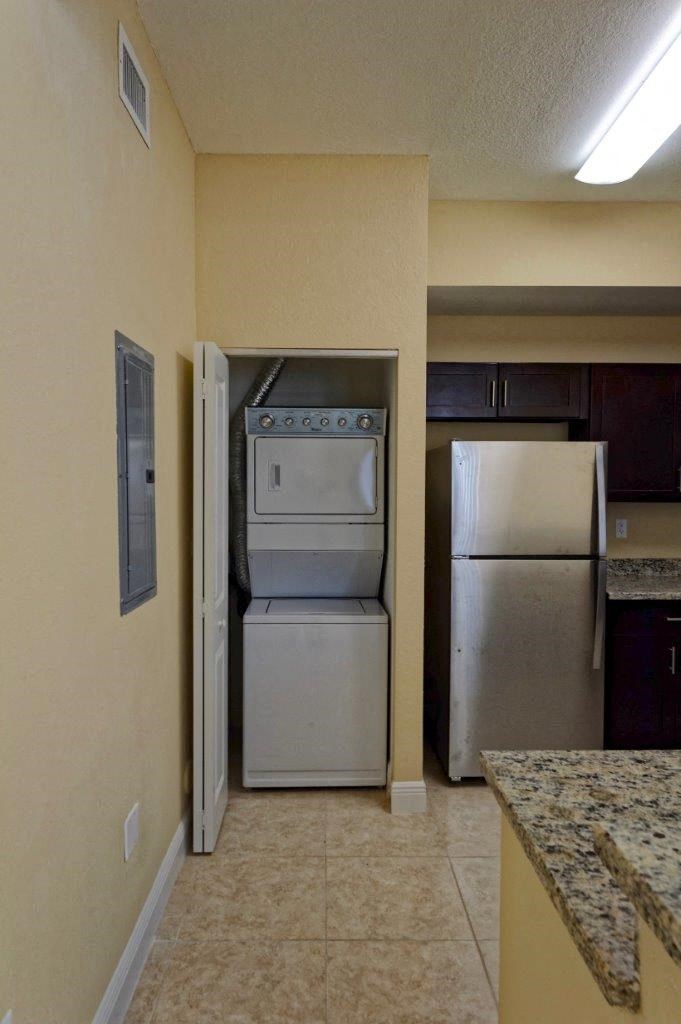 a kitchen with a stove and a refrigerator