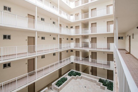a view of the courtyard of an apartment building