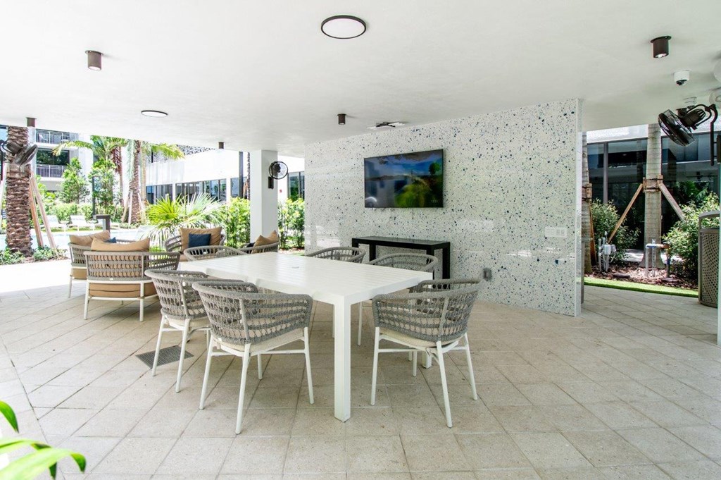 a dining room with a table and chairs and a fireplace