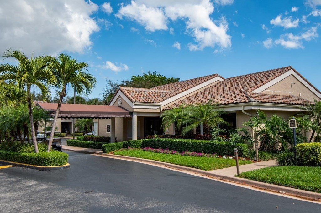 a house with palm trees in front of it