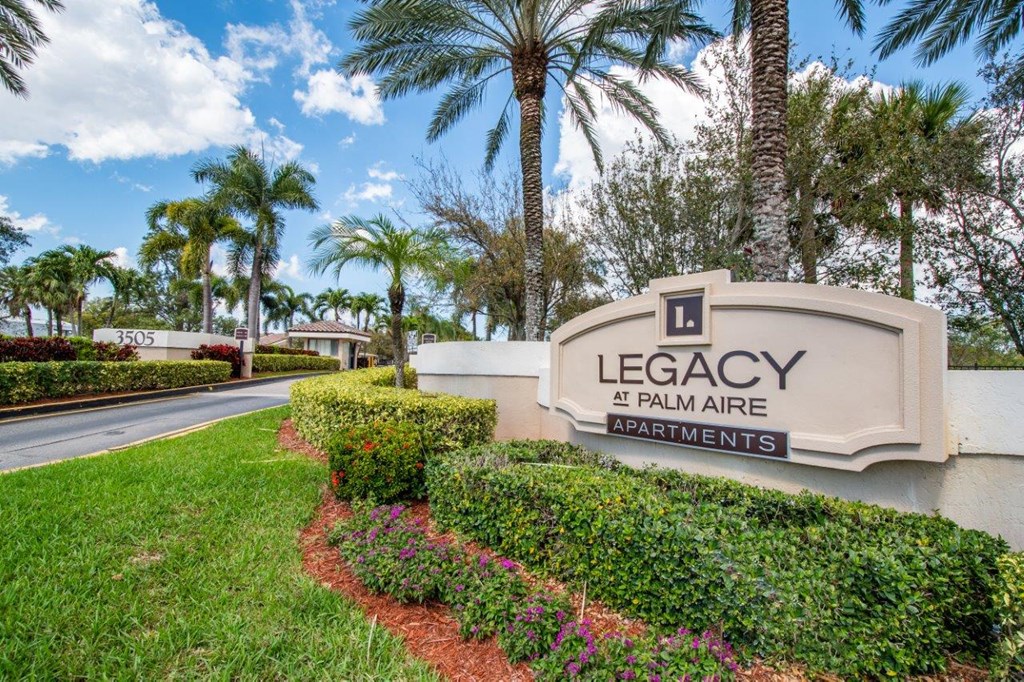 the entrance to legacy palm tree apartments in palm tree