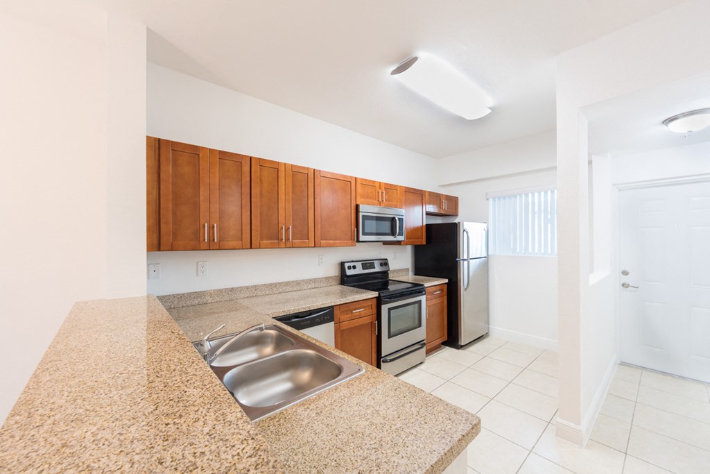 a kitchen with a granite counter top and a sink