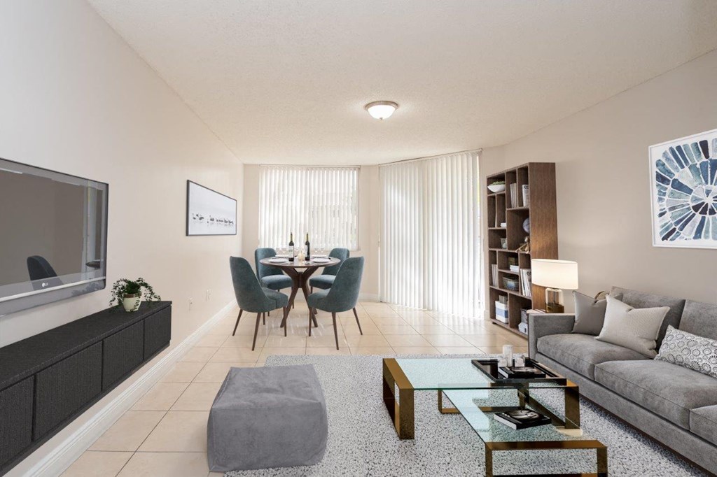 a living room and dining room with a couch and a table