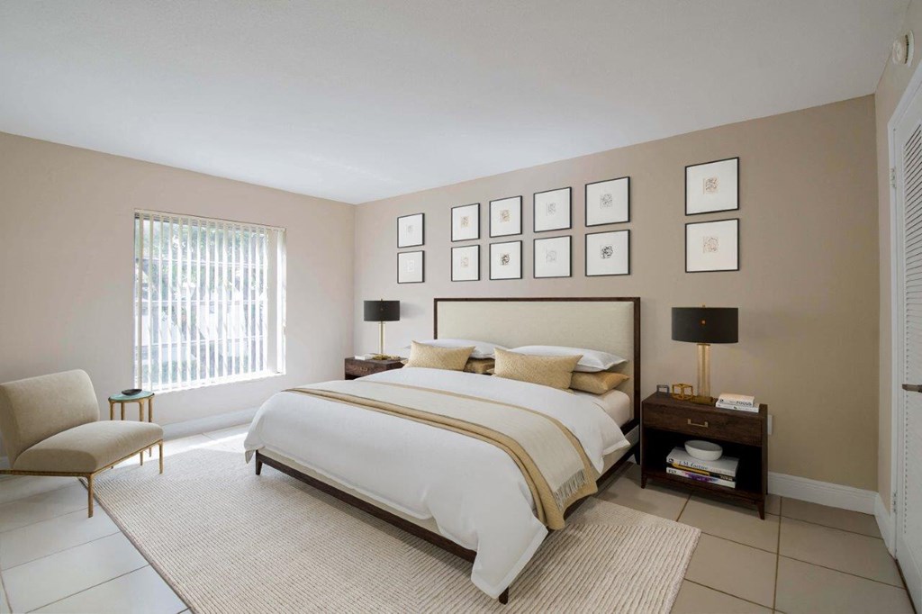 a bedroom with a bed and pictures on the wall