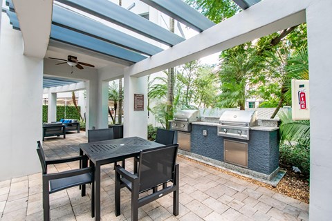 A patio with a table and chairs is shown.