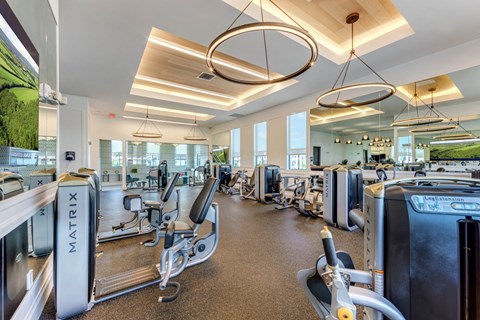 a gym with cardio machines and other exercise equipment