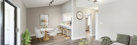 A modern living room with a dining area and a kitchen in the background.