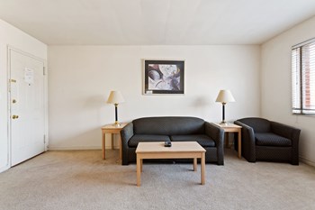 Living room with sofa, end tables, and coffee table - Photo Gallery 6