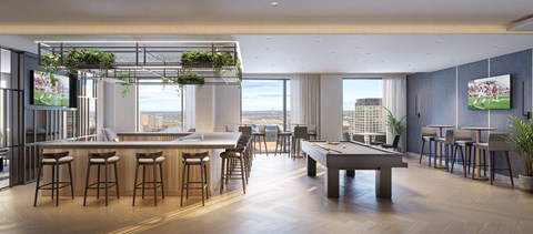 A modern bar with a pool table and a view of the city.