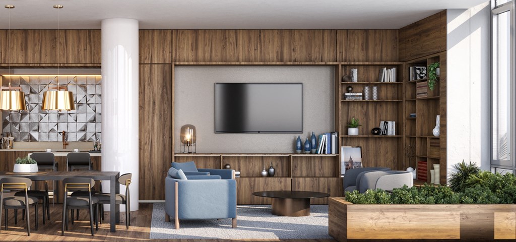 a living room with a tv and a table and chairs