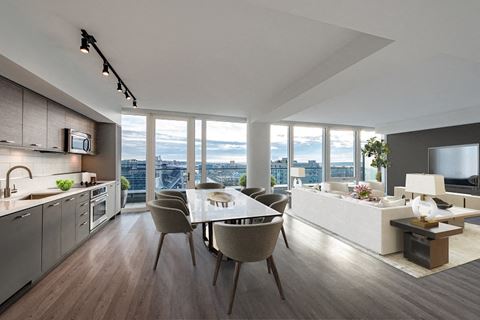 a kitchen and dining room with a view of the city