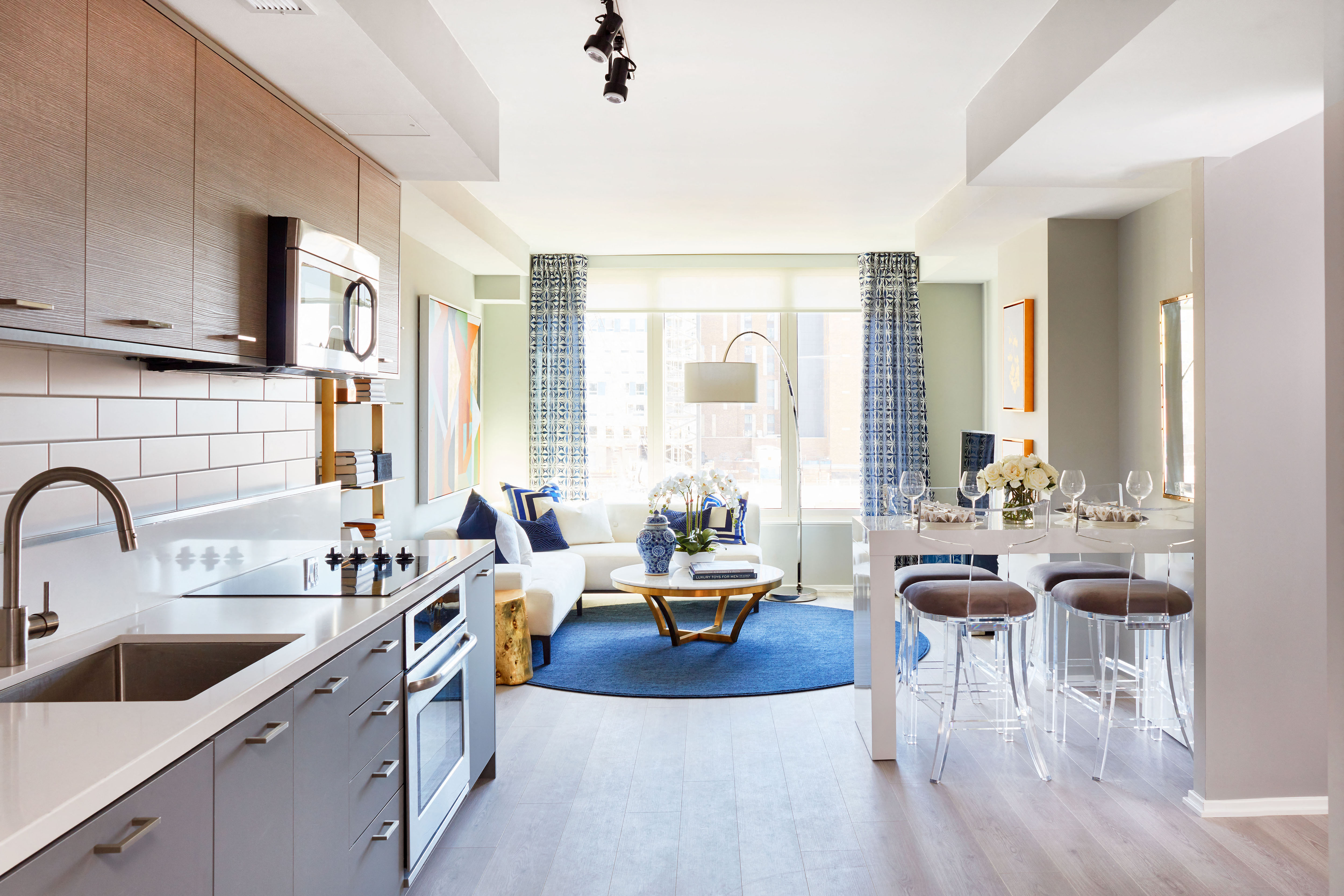 a living room with a kitchen and a dining room