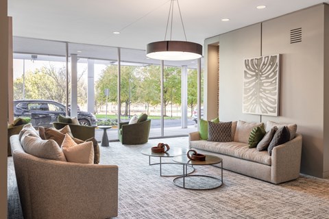 a living room with couches and chairs and a table