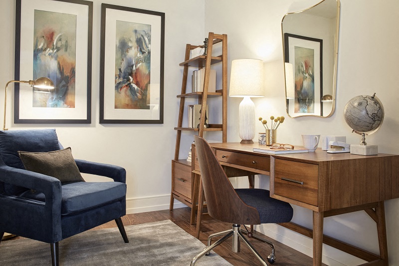 a home office with a desk and a chair