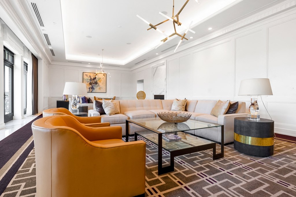 a living room filled with furniture and a large window