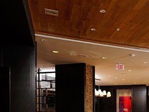 Lounge with multiple seating areas and large windows
