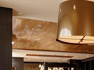 Modern table and chairs with a large lighting fixture