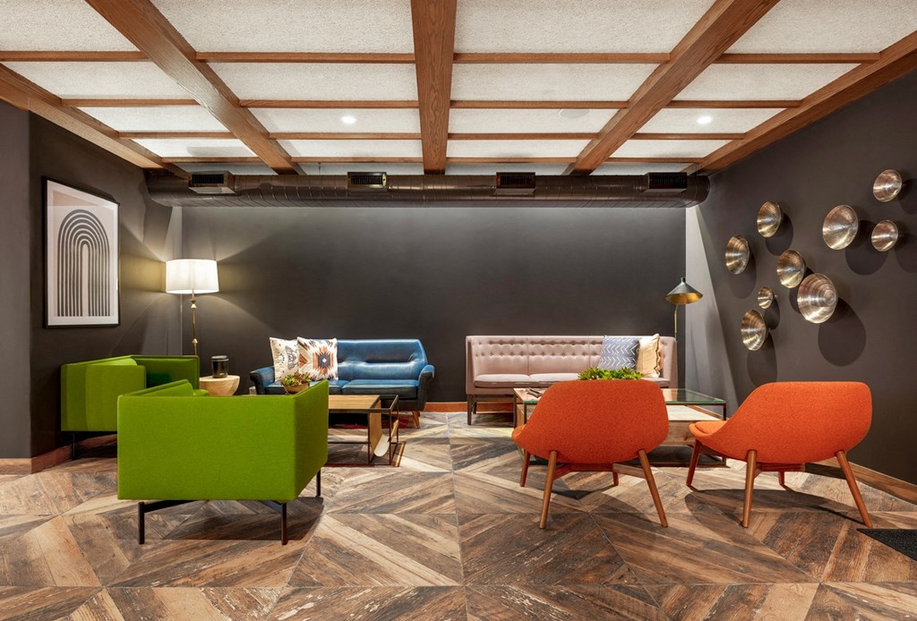 a lobby with chairs and couches and a table