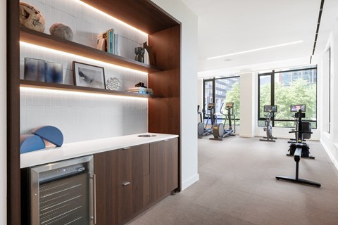 A modern kitchen with a stainless steel dishwasher and wooden cabinets.