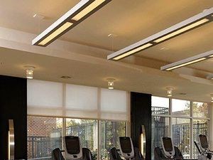 Fitness center with large windows, treadmills and a workout bench