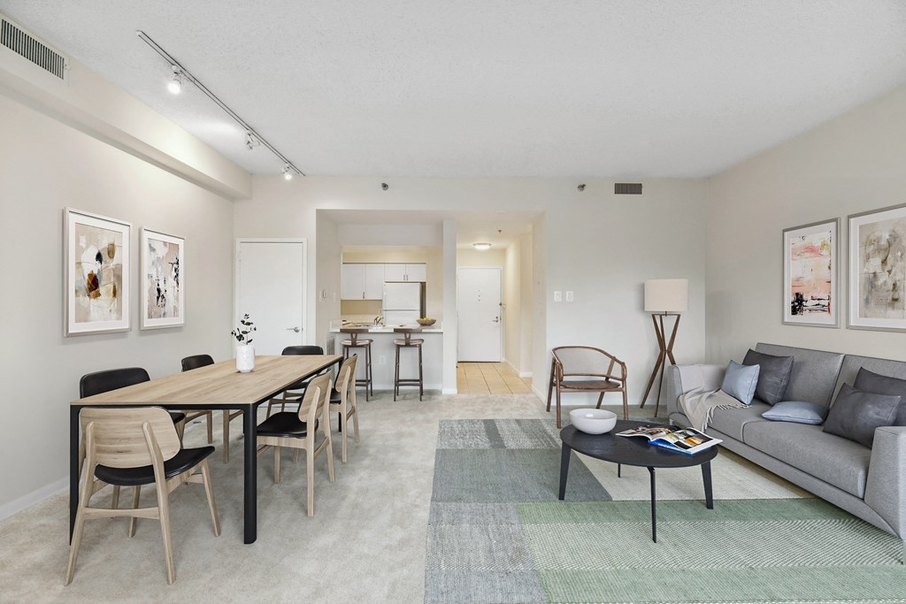 a living room with a couch and a dining room table