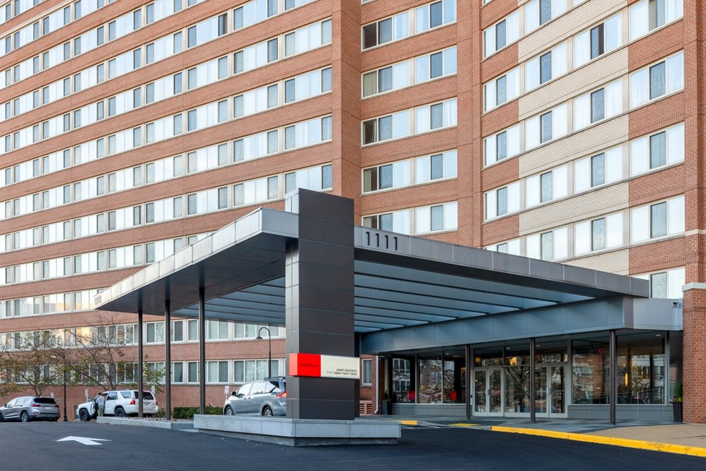 a large brick building with an awning in front of it