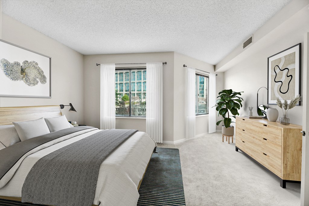 a bedroom with a bed and a dresser