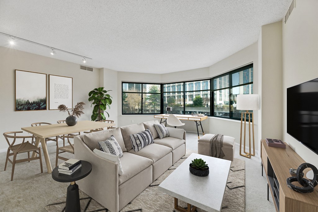 a living room with a couch and a table and a tv