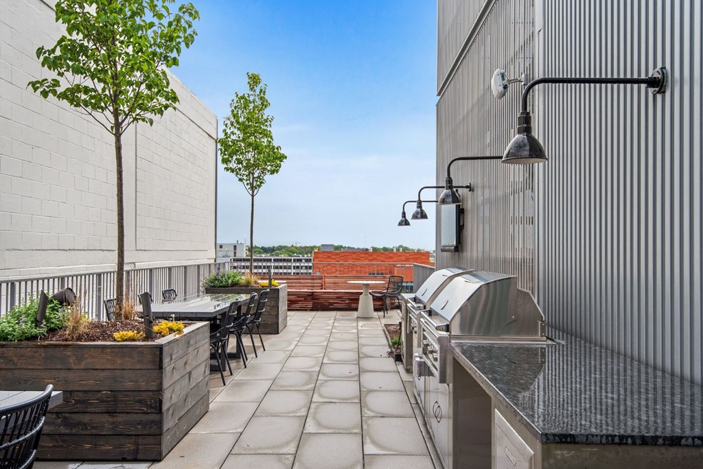 the outdoor patio of a building with tables and chairs