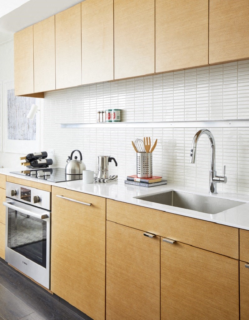 a kitchen with wooden cabinets and a sink