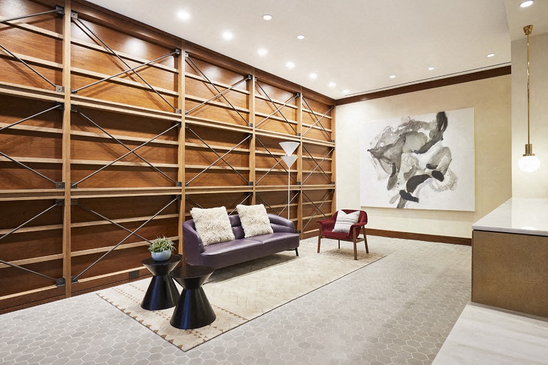 the lobby of a hotel with a couch and chairs