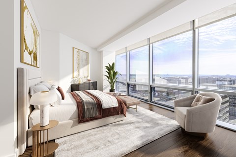 a bedroom with a bed and a chair in a 555 waverly unit  at 220 Twentieth Street, Arlington