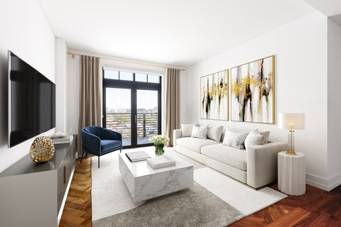 a living room with a white couch and a television