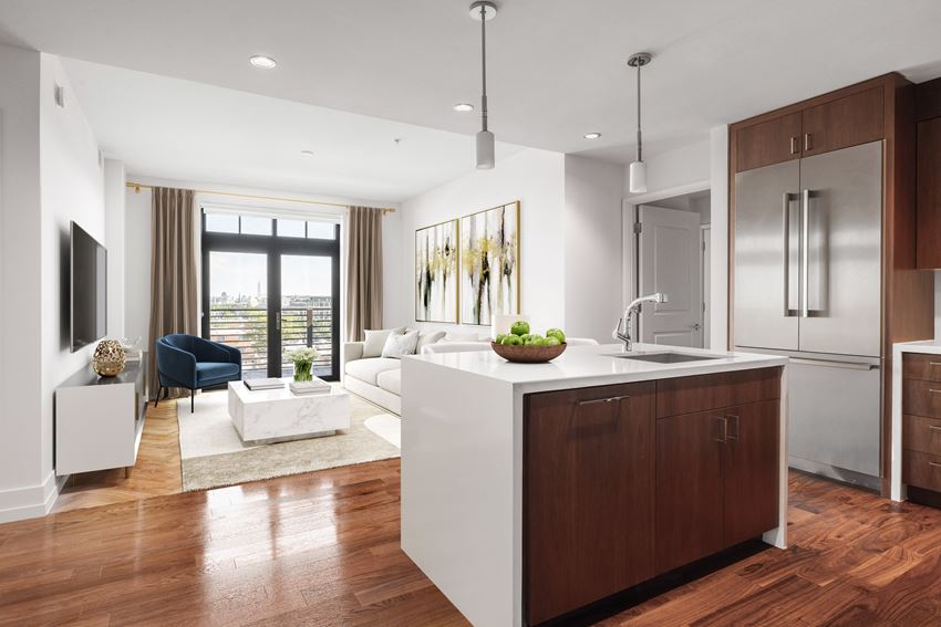 a kitchen and living room in an open floor plan